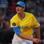 Garrett Whitlock in Red Sox yellow and blue uniform