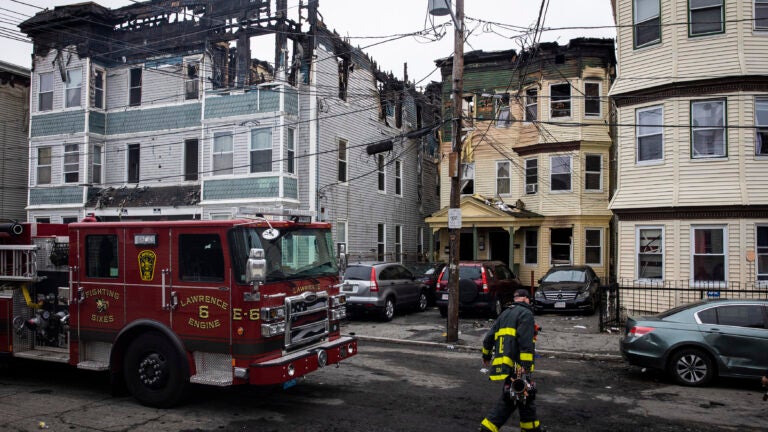 6 alarm fire in Lawrence rages through several homes