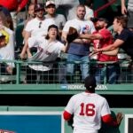 Franchy Cordero of the Red Sox watches a home run soar over the bullpen.