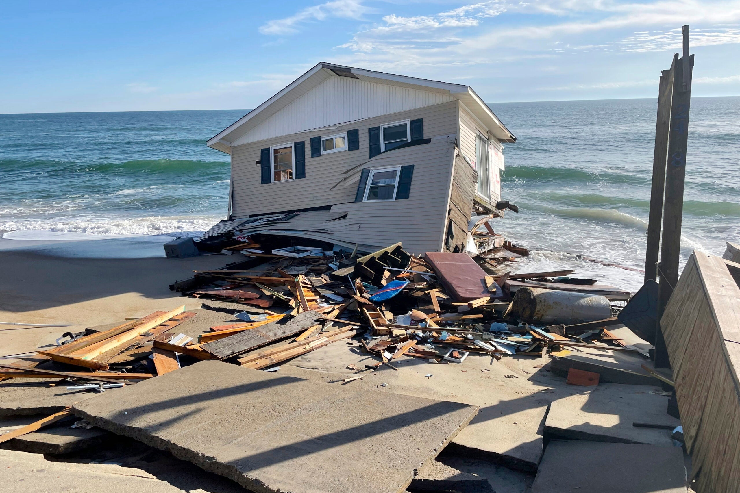 2 North Carolina beach houses collapse into the Atlantic surf