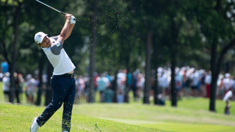 K.H. Lee, of South Korea, hits on the third hole during the fourth round of the AT&T Byron Nelson golf tournament in McKinney, Texas, on Sunday, May 15, 2022.