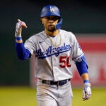 Mookie Betts gives thumbs up in Dodgers uniform.