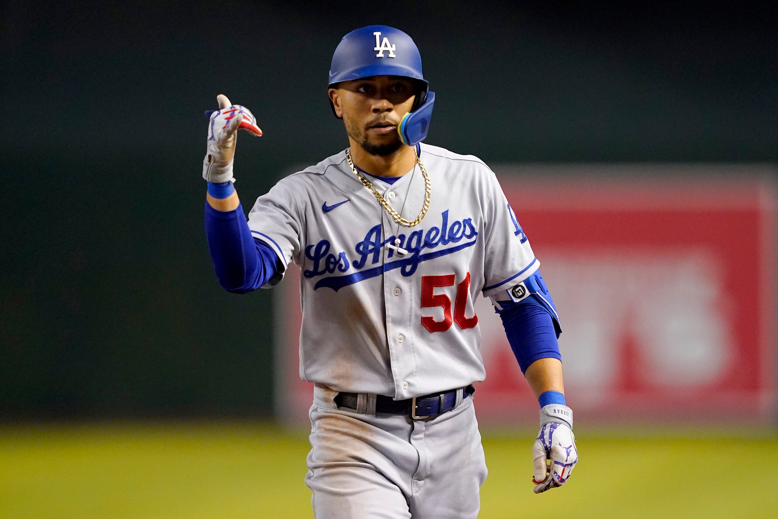 Mookie Betts gives thumbs up in Dodgers uniform.