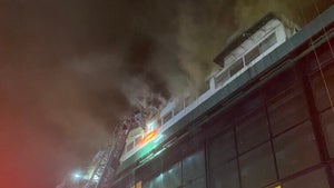 Firefighters run thousands of feet of hose to battle 6-alarm Suffolk ...