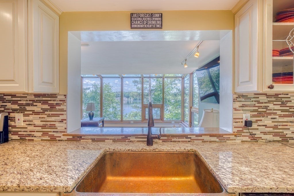 Listed A waterfront home in Westford with decks and views galore