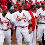 Yadier Molina, Albert Pujols, and Adam Wainwright of the St. Louis Cardinals