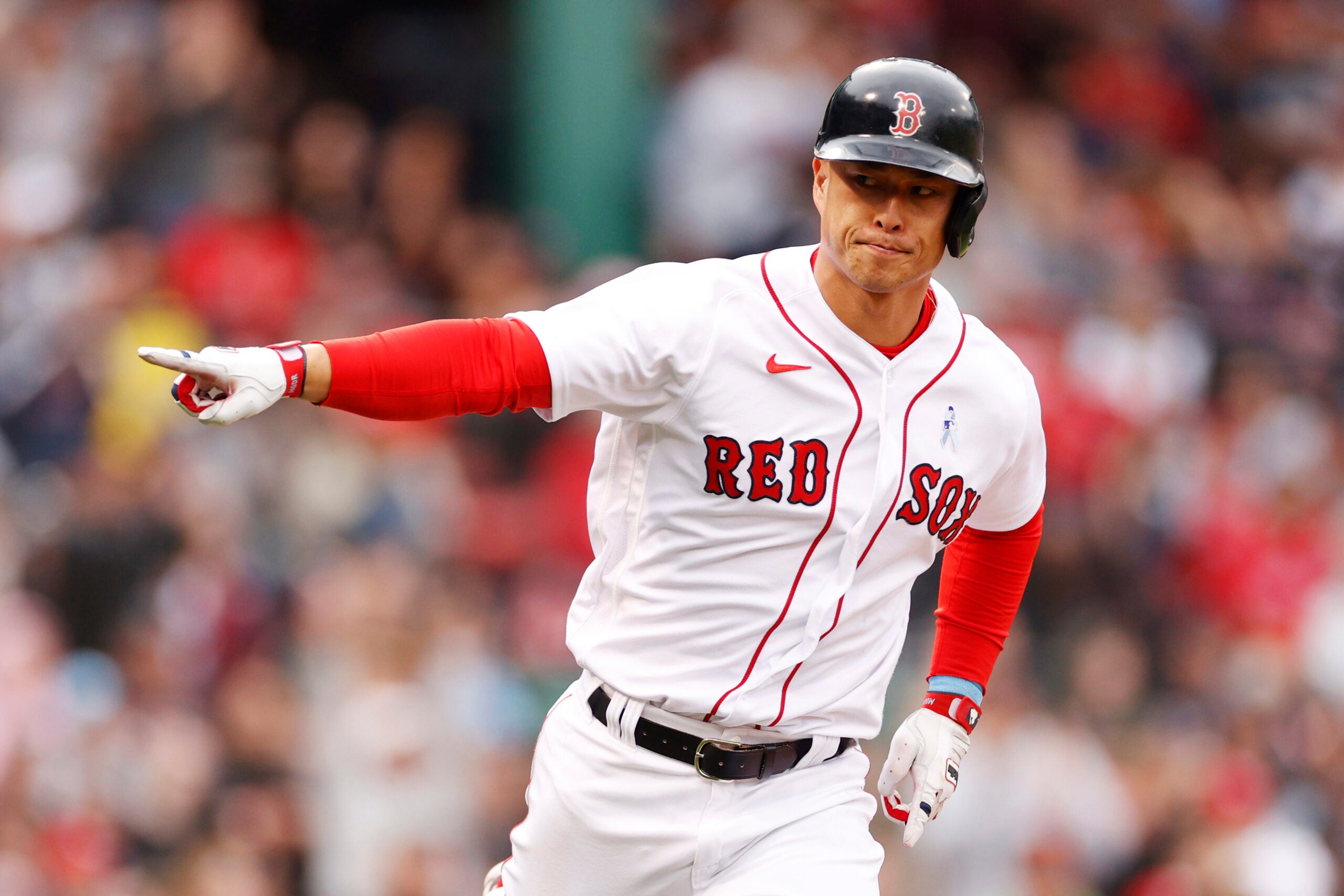 Rob Refsnyder points after an RBI single for the Red Sox