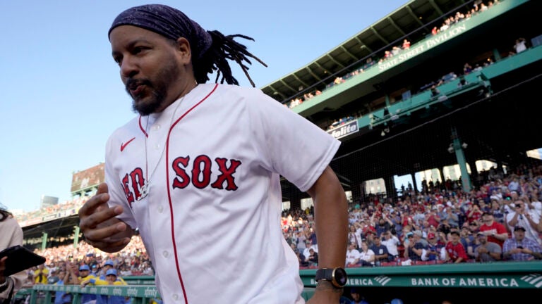 Boston Red Sox Manny Ramirez victorious with Kevin Millar during