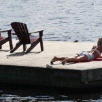 Boston weather -- , MA, 06/28/2022, Warm weather brought people out to the Esplanade to sun on the deck.