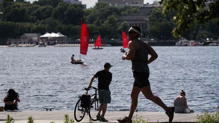 Boston weather -- , MA, 06/28/2022, Warm temperatures brought joggers, bikers, loungers and sailors out to the Charles River.