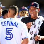 Rafael Devers laughs with Toronto's Santiago Espinal at the Home Run Derby.
