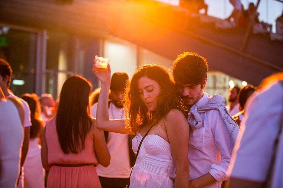 Attendees dance at the ICA's White Hot Sunset Waterfront Party