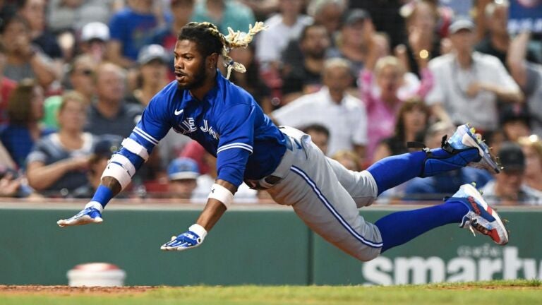 Neither wind, rain delay, nor triple play could derail the Red Sox in a  victory over the National League-leading Braves - The Boston Globe