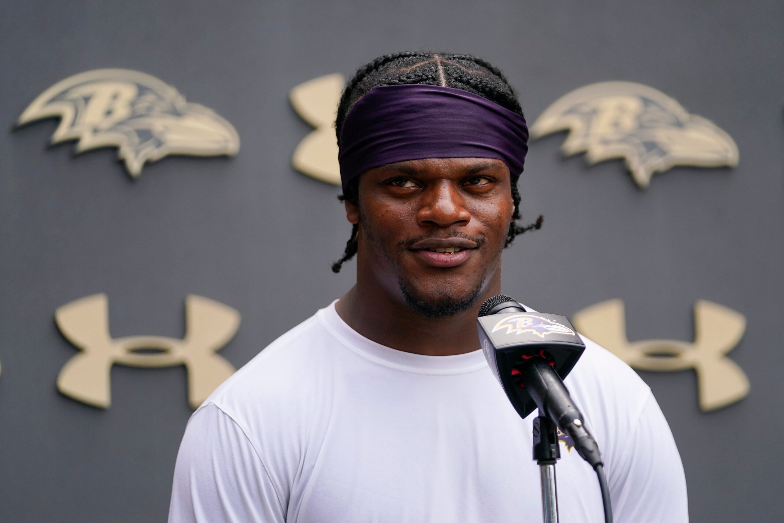 Baltimore Ravens quarterback Lamar Jackson talks to reporters during the team's NFL football training camp, Thursday, July 28, 2022, in Owings Mills, Md.