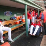 Rafael Devers rides in Red Sox laundry cart.