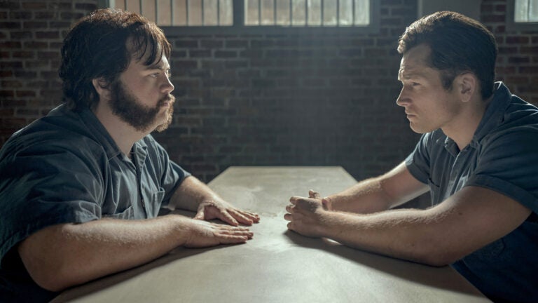 Paul Walter Hauser, left, as Larry, and Taron Egerton as Jimmy in 