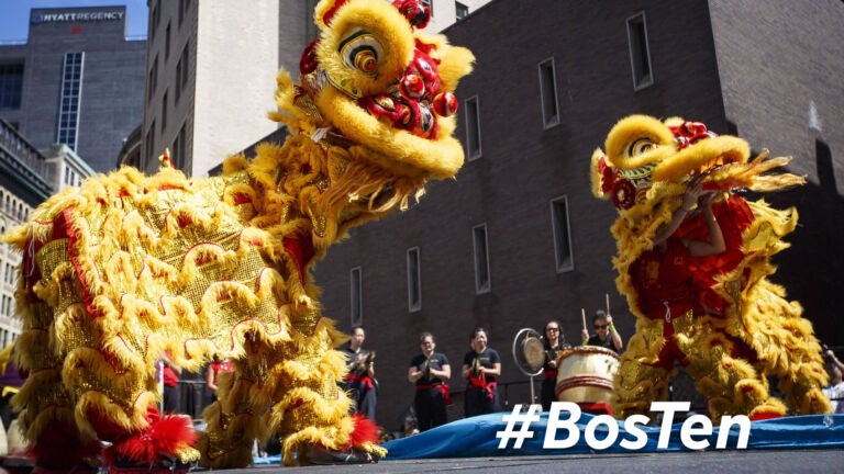 Gund Kwok Asian Women's Lion and Dragon Dance Troupe perform a lion dance during the August Moon Festival in Chinatown.
