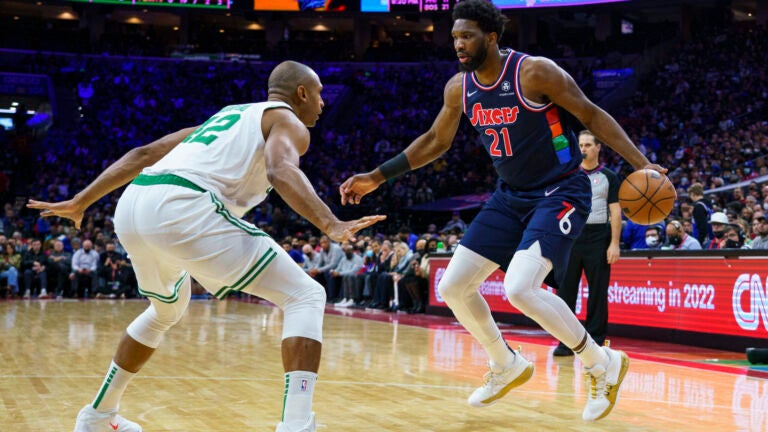Philadelphia 76ers' Joel Embiid, right, in action against Boston Celtics' Al Horford.