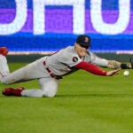 Jarren Duran diving and failing to catch a ball in the outfield.