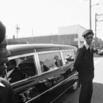 Black Panthers stand guard on Aug. 28, 1971, in Oakland, Calif., while the hearse carrying the body of George Jackson was brought to St. Augustine's Episcopal Church.