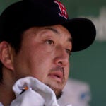 Hirokazu Sawamura looks on exasperated from the Red Sox dugout.