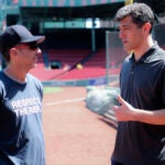Rey Fuentes and Chaim Bloom talking on the field at Fenway Park
