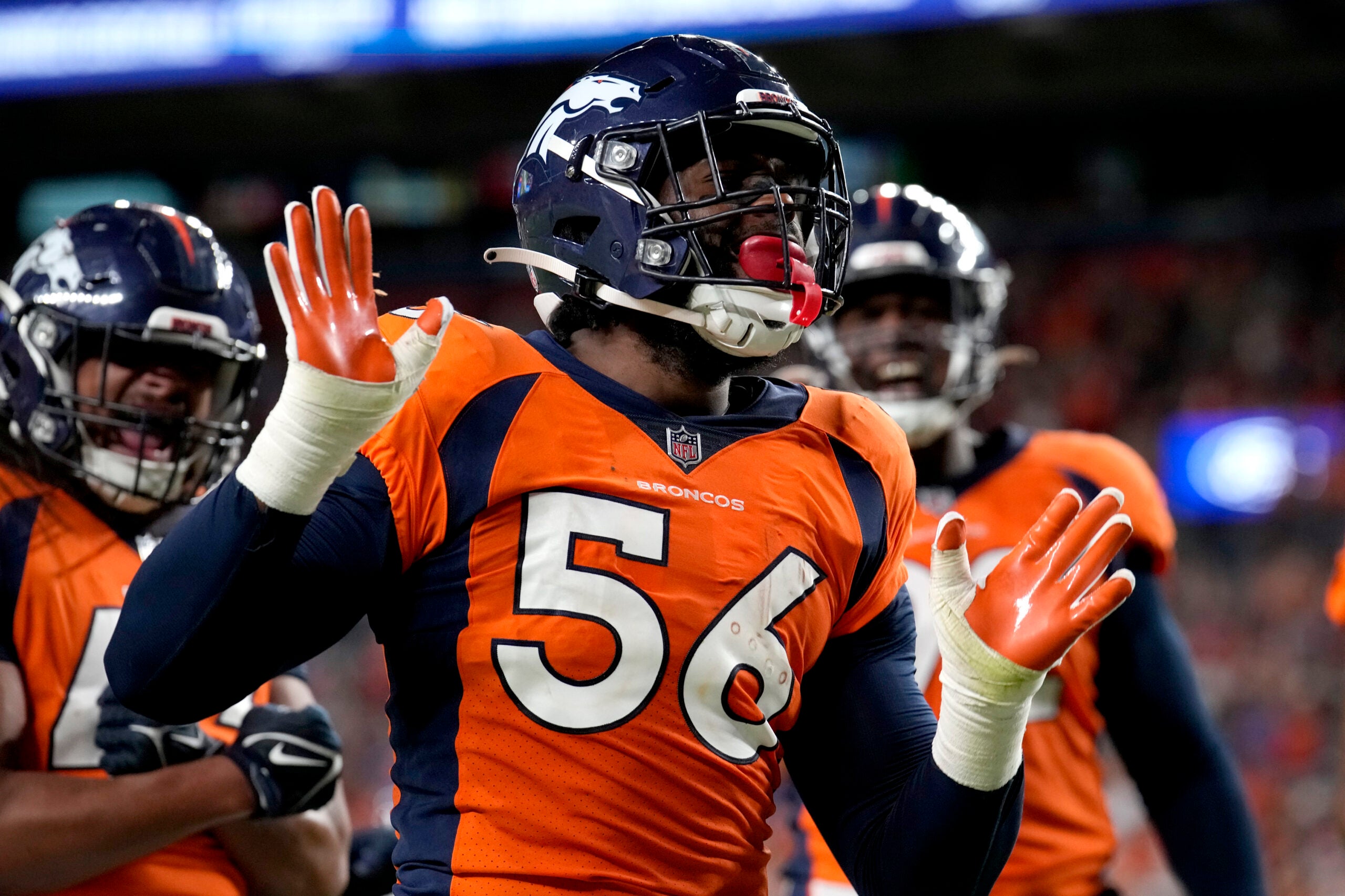 Denver Broncos linebacker Baron Browning (56) celebrates his touchdown against the Minnesota Vikings during the first half of an NFL preseason football game, Saturday, Aug. 27, 2022, in Denver.