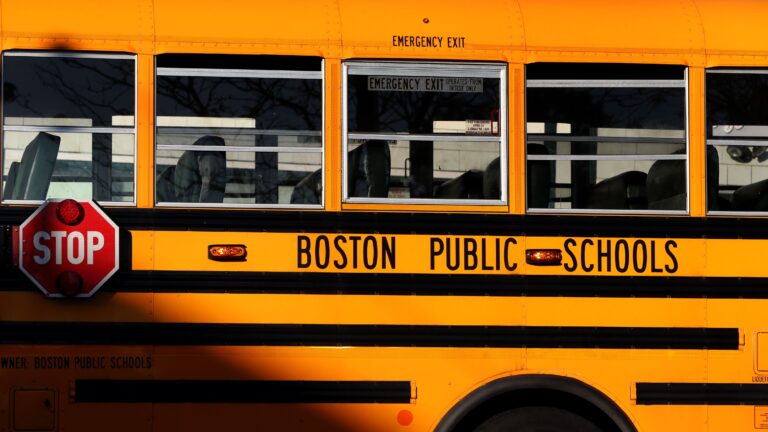 alt = empty, yellow Boston Public Schools bus