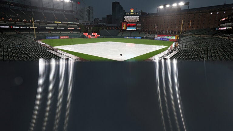 Orioles tied for wild card after rainout with Blue Jays