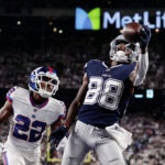 Dallas Cowboys wide receiver CeeDee Lamb (88) makes a catch in the end zone for a touchdown against New York Giants cornerback Adoree' Jackson (22) during the fourth quarter of an NFL football game, Monday, Sept. 26, 2022, in East Rutherford, N.J.