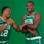 Boston Celtics forward Grant Williams, left, jokes with center Al Horford, right, as the NBA basketball players stand for photos during the team's Media Day, Monday, Sept. 26, 2022, in Canton, Mass