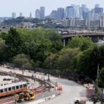 Orange Line trains are seen in the yard at Wellington Station.