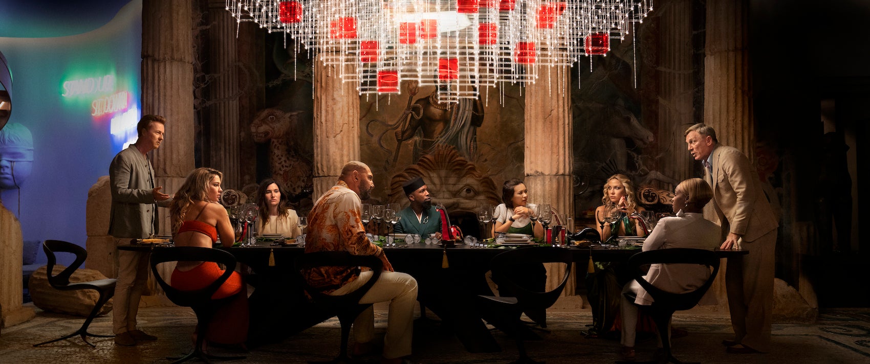 (L-R) Edward Norton, Madelyn Cline, Kathryn Hahn, Dave Bautista, Leslie Odom Jr., Jessica Henwick, Kate Hudson, Janelle Monae, and Daniel Craig in "Glass Onion: A Knives Out Mystery."
