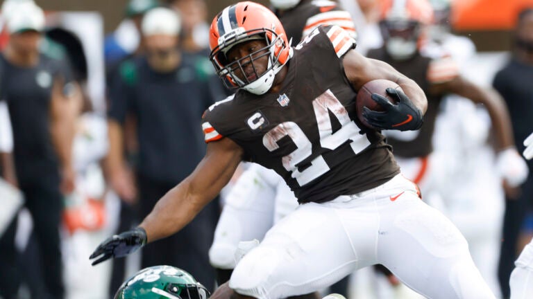Cleveland Browns running back Nick Chubb (24) is stopped by New York Jets safety Jordan Whitehead during the second half of an NFL football game, Sunday, Sept. 18, 2022, in Cleveland.