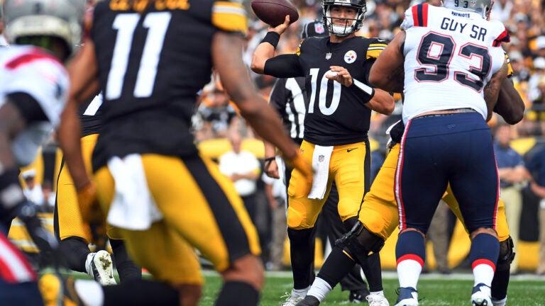 Pittsburgh Steelers quarterback Mitch Trubisky (10) throws a pass to Chase Claypool (11) during the first half of an NFL football game against the New England Patriots in Pittsburgh, Sunday, Sept. 18, 2022.