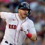 Trevor Story looks up the line as he leaves the batter's box on an RBI double Sunday.
