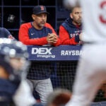 A weary Alex Cora looks on the from the Red Sox dugout as his team is swept once again by the Rays.
