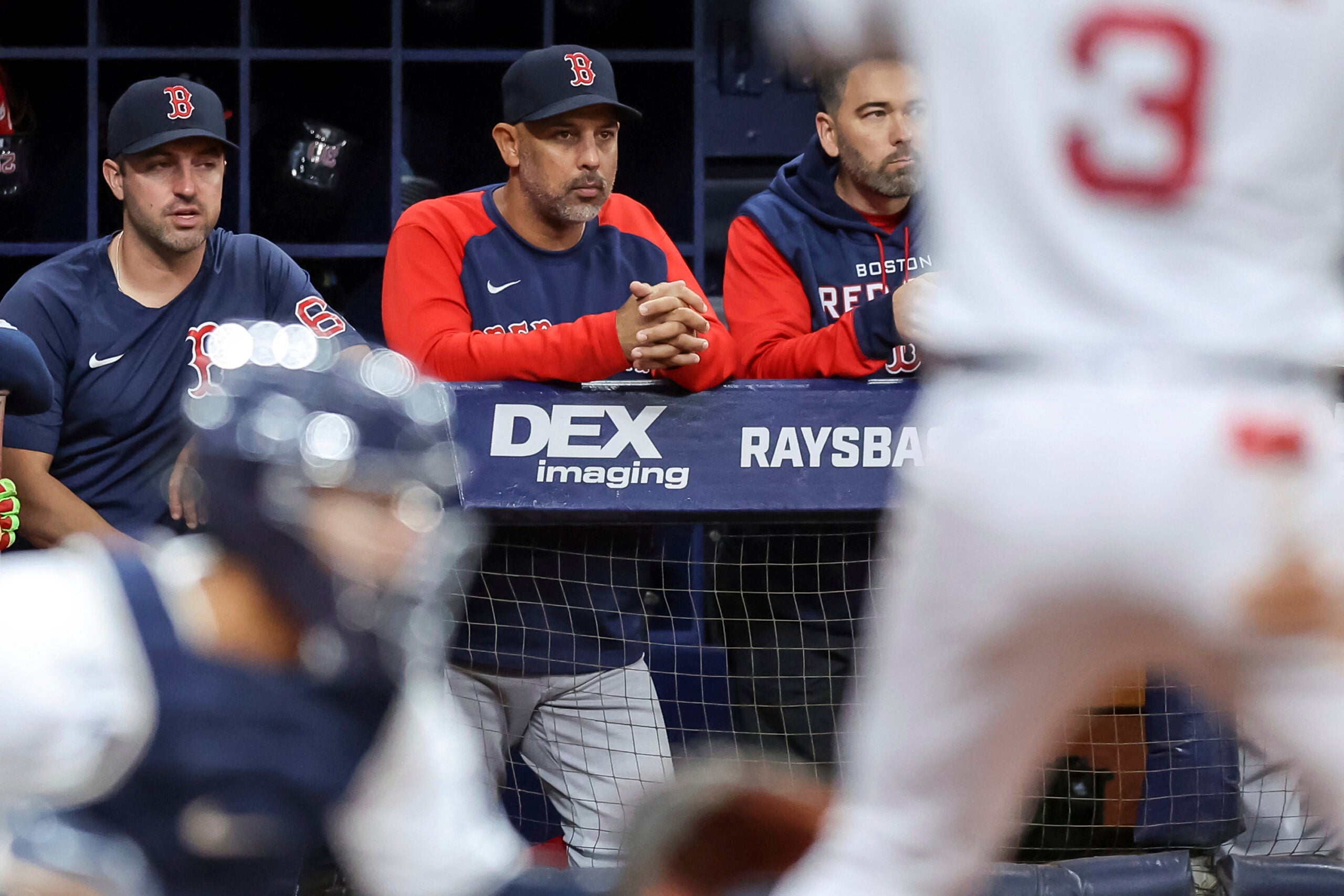 A weary Alex Cora looks on the from the Red Sox dugout as his team is swept once again by the Rays.