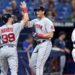 Boston Red Sox's Triston Casas, center, is congratulated by Christian Arroyo on his two-run home run.