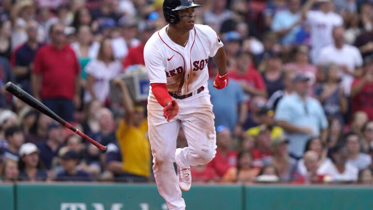 Boston Red Sox's Rafael Devers runs to first after hitting a two-run single in the fifth inning of a baseball game against the Kansas City Royals, Sunday, Sept. 18, 2022, in Boston.