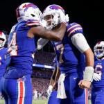 Buffalo Bills' Stefon Diggs, second from left, celebrates with quarterback Josh Allen, second from right, after they connected for a touchdown during the second half of an NFL football game against the Tennessee Titans, Monday, Sept. 19, 2022, in Orchard Park, N.Y.