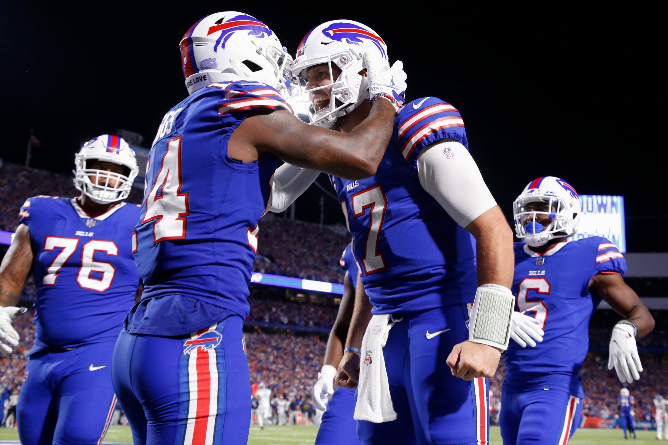Buffalo Bills' Stefon Diggs, second from left, celebrates with quarterback Josh Allen, second from right, after they connected for a touchdown during the second half of an NFL football game against the Tennessee Titans, Monday, Sept. 19, 2022, in Orchard Park, N.Y.