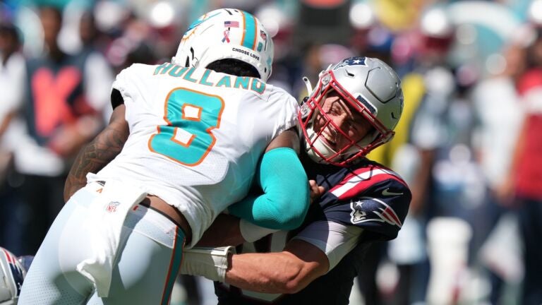 Miami Dolphins' Jevon Holland helmet decal is seen before an NFL