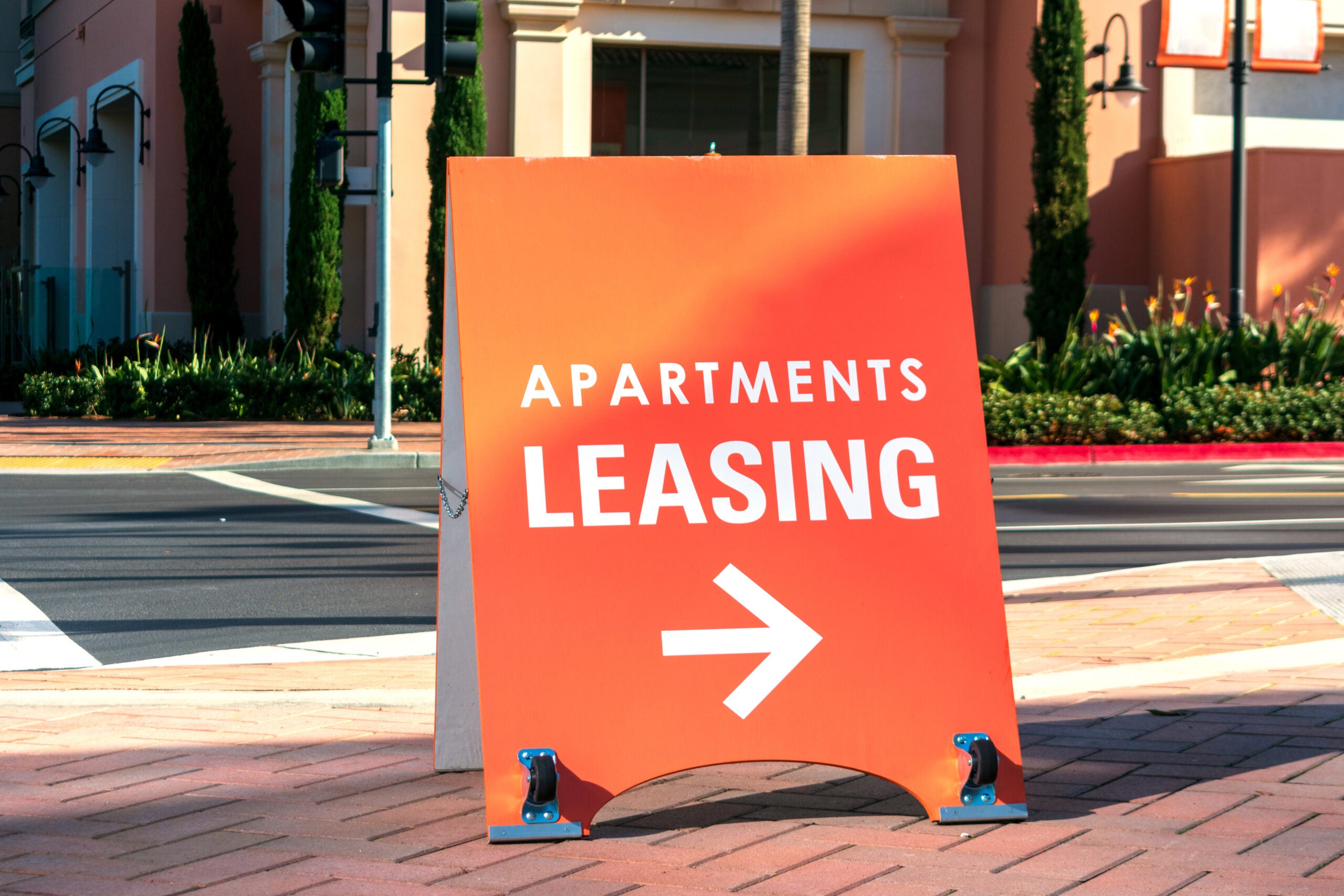 Apartment leasing sign promote the rental property and shows direction where the rental office is located.