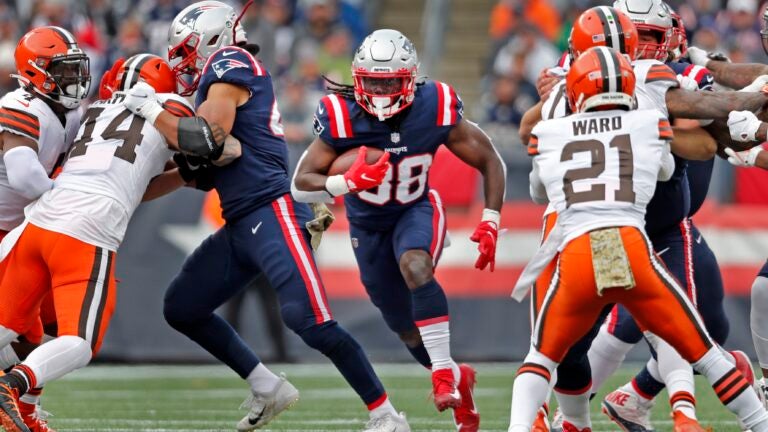 New England Patriots running back Rhamondre Stevenson turns sliver