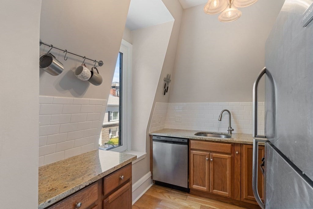 For 975k, a South Boston condo with two bedrooms and a rooftop deck