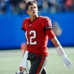 Tampa Bay Buccaneers quarterback Tom Brady (12) looks at the scoreboard after failing to convert a fourth down play in the fourth quarter during the second half of an NFL football game against the Carolina Panthers Sunday, Oct. 23, 2022, in Charlotte, N.C.