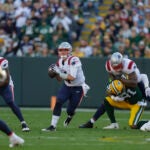 Bailey Zappe scrambles during the Patriots-Packers game.