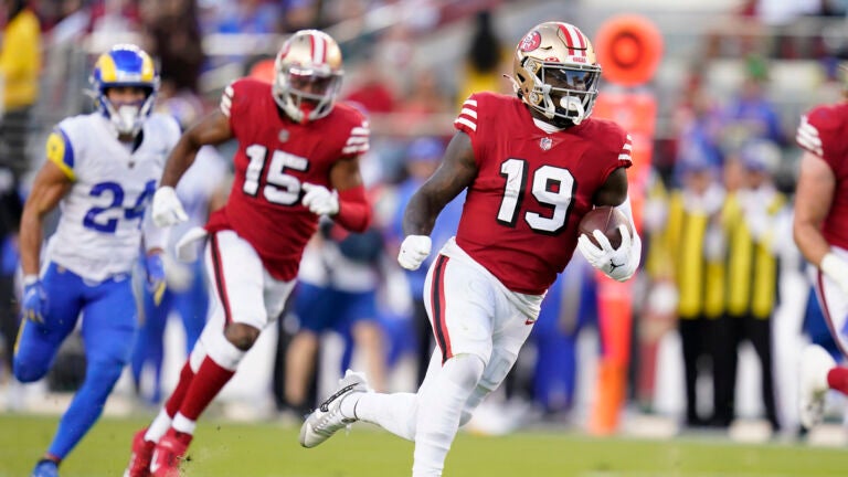San Francisco 49ers wide receiver Deebo Samuel (19) runs toward the end zone to score against the Los Angeles Rams during the first half of an NFL football game in Santa Clara, Calif., Monday, Oct. 3, 2022.
