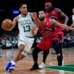 Celtics guard Malcolm Brogdon drives to the basket against the Raptors.